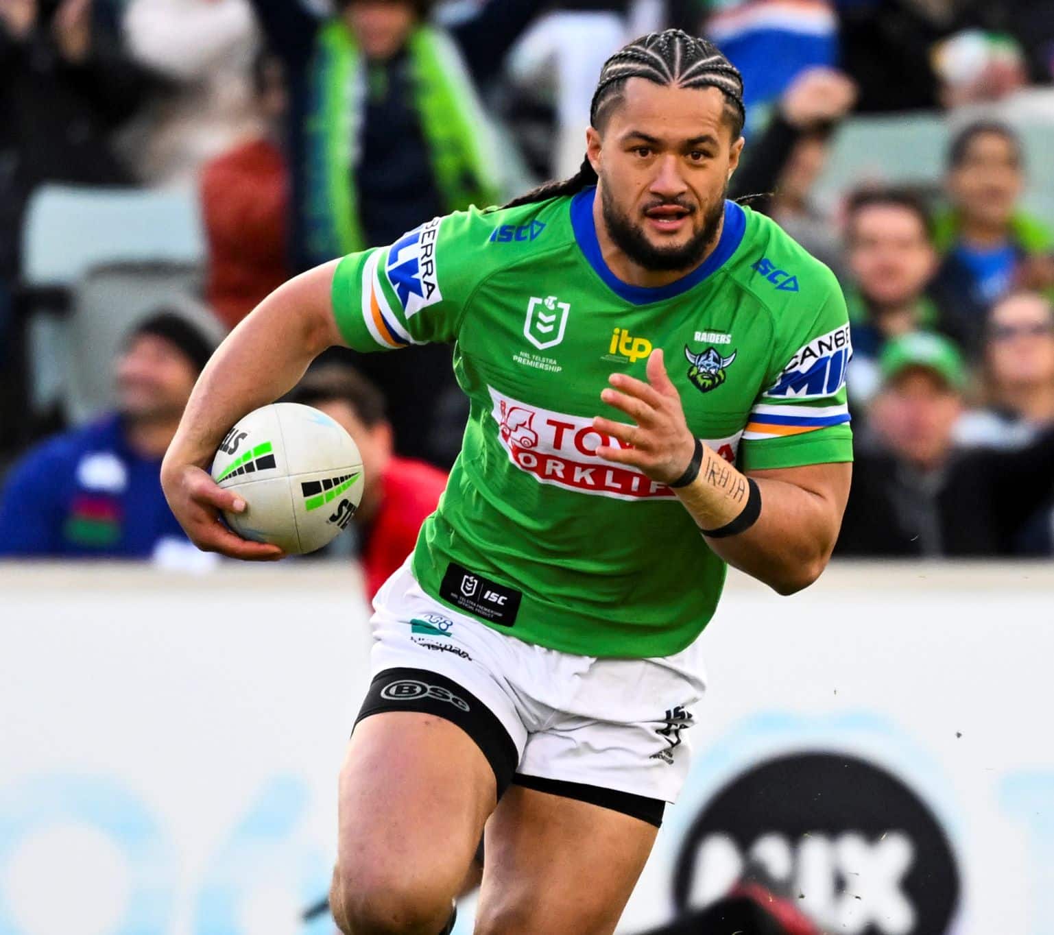 Corey Harawira-Naera of the Raiders running with the ball during an NRL match