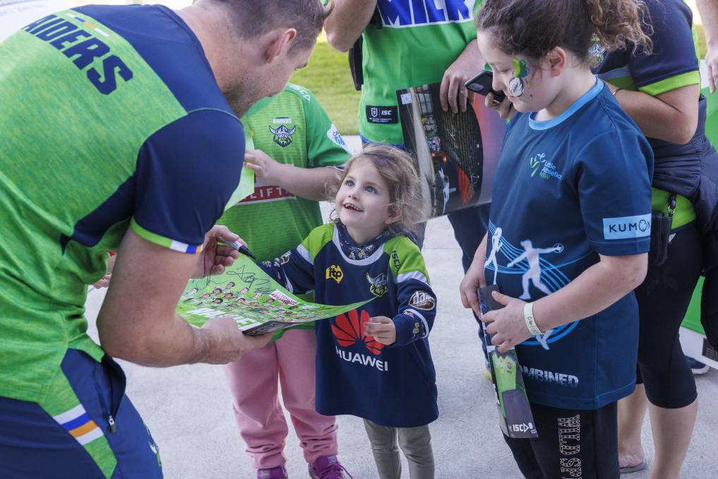 Raiders co-captain Jarrod Croker makes one young fan's day at the members day at their Braddon centre of excellence on Wednesday. Picture by Keegan Carroll