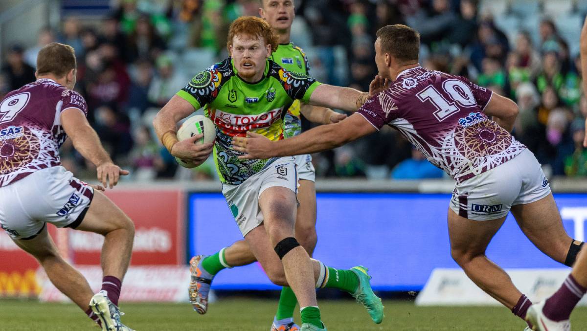 Raiders forward Corey Horsburgh runs at Manly players. Picture by Gary Ramage