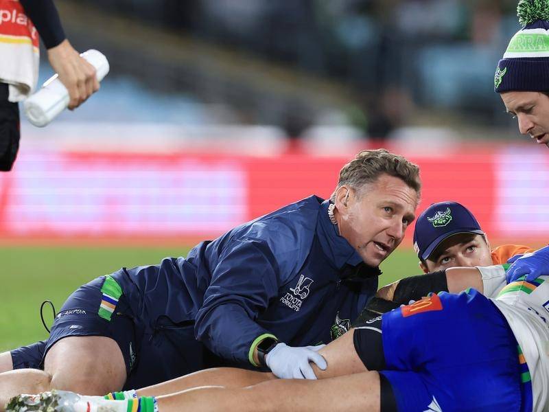 Medical staff attend to Raiders' Corey Harawira-Naera after he collapsed to the turf. (Mark Evans/AAP PHOTOS)