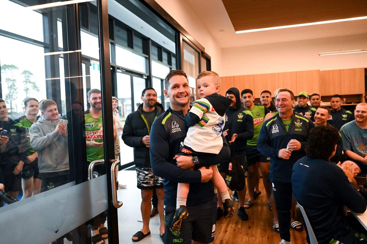 Jarrod Croker of the Raiders carries his son Rory as he arrives for a Canberra Raiders NRL press conference at Raiders Centre, in Canberra, Monday, June 5, 2023