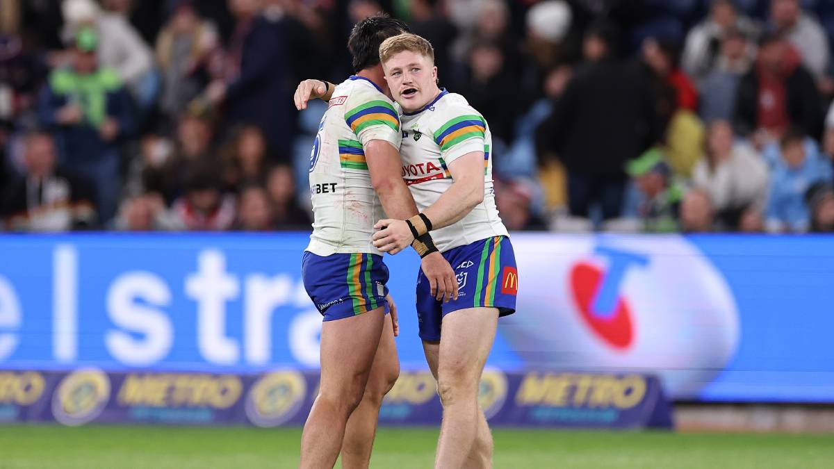 Jordan Rapana and Zac Woolford celebrate Canberra's win. Picture Getty Images