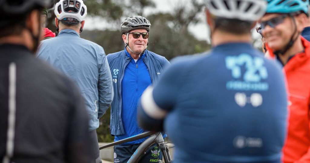 Ricky Stuart pedals with purpose in non-lycra attire.