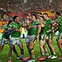 Canberra celebrate a late wonder try by Kaeo Weekes (2nd l) in a golden-point win over Melbourne. Photo: HANDOUT/NRL PHOTOS