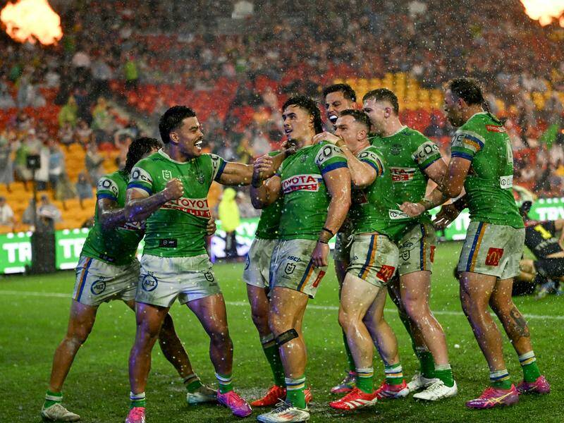 Canberra celebrate a late wonder try by Kaeo Weekes (2nd l) in a golden-point win over Melbourne. Photo: HANDOUT/NRL PHOTOS