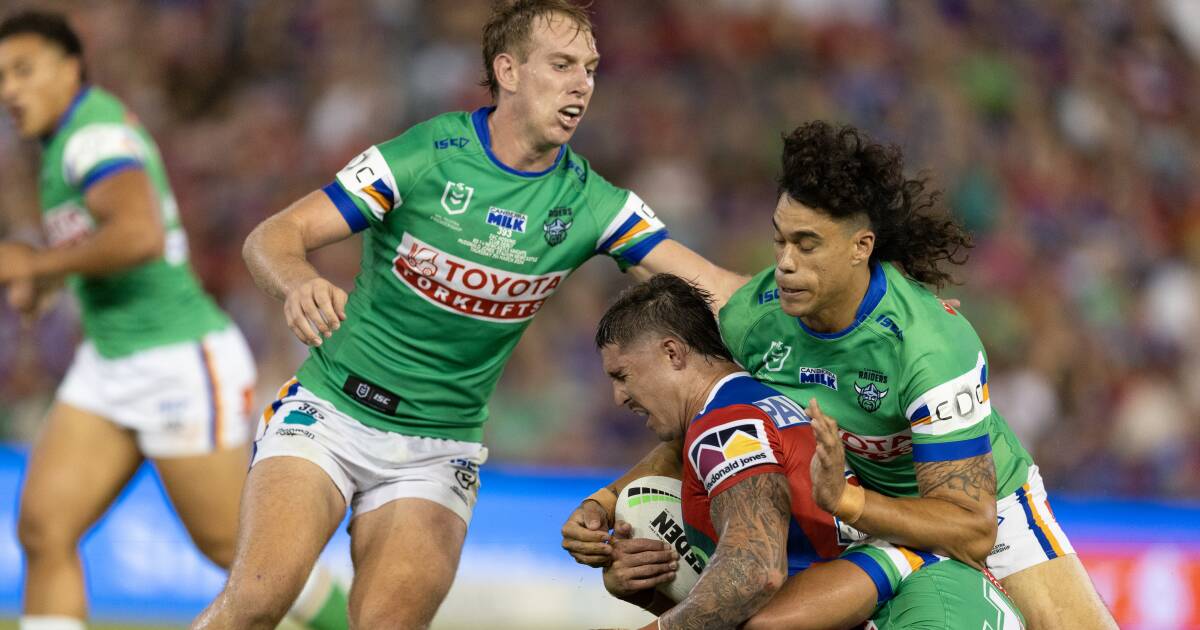 Pasami Saulo, right, playing for Canberra against Newcastle last year. Picture by Jonathan Carroll