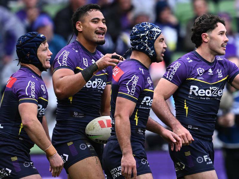 Eli Katoa has scored two of six Melbourne tries in the win over the Knights in Newcastle. Photo: Joel Carrett/AAP PHOTOS