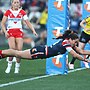 Olivia Kernick soars through the air to score in the Roosters' win over the Dragons. Photo: Mark Kolbe/AAP PHOTOS