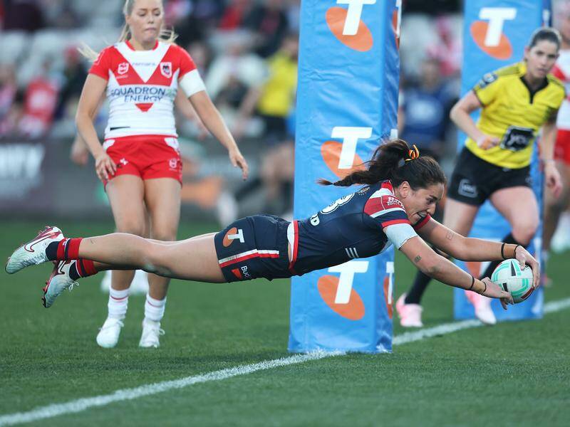Olivia Kernick soars through the air to score in the Roosters' win over the Dragons. Photo: Mark Kolbe/AAP PHOTOS