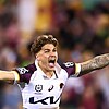 A man celebrates after winning a rugby league match