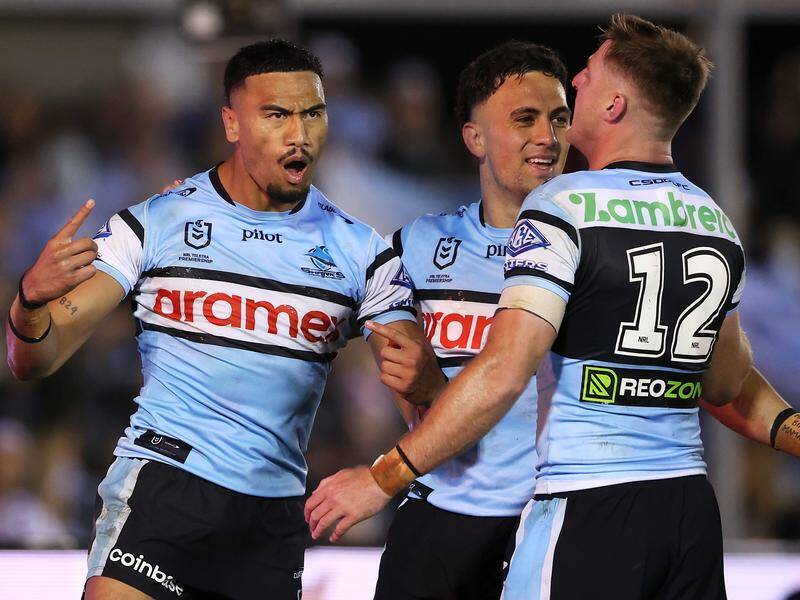 Cronulla are confident winger Ronaldo Mulitalo (L) will keep his emotions under control in Canberra. Photo: Mark Kolbe/AAP PHOTOS