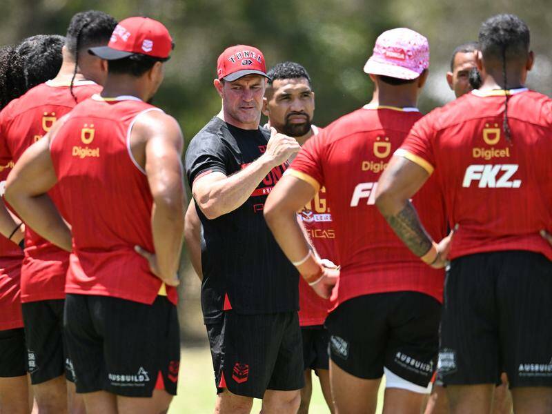 Tonga coach Kristian Woolf (centre) wants his players to be given more respect from the NRL. Photo: Darren England/AAP PHOTOS