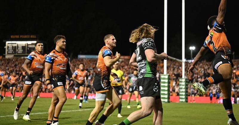 An Adam Doueihi try against the Raiders had Wests Tigers' Sunia Turuva jumping for joy. Photo: Dean Lewins/AAP PHOTOS