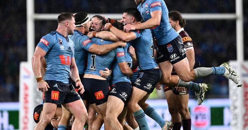 NSW celebrate their come-from-behind win over Queensland in Game 1 of State of Origin. Photo: Dan Himbrechts/AAP PHOTOS